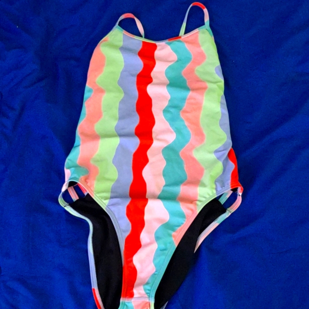 Jolyn Practice suit, multi color, lightly used